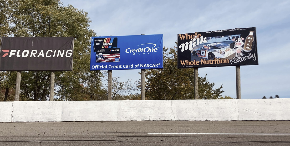 FloRacing, Credit One and Whole Milk billboards standing above the turn 3 wall