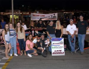 Barry Awtey celebrates his record breaking win with family and team members in Jennerstown Speedway Complex victory lane.